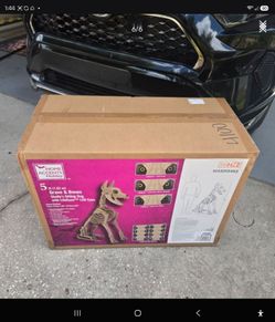 ( New in box) 5 ft graven Bone Skelly sitting dog Lcd eyes