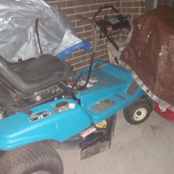 gas powered riding Dixxon lawnmower 