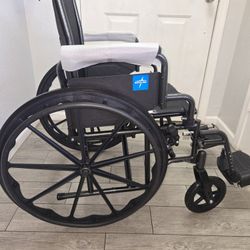 Medline Comfortable Folding Wheelchair with Swing-Back Desk-Length Arms and Swing-Away Footrests