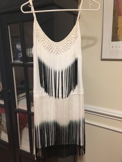 Brand new dress with tags boutique fringe dress. Size small.