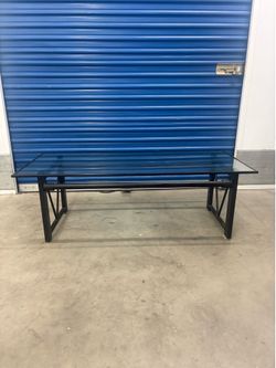 Glass top cocktail table