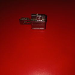 Vintage Tight Clip With Cigarette Lighter On It