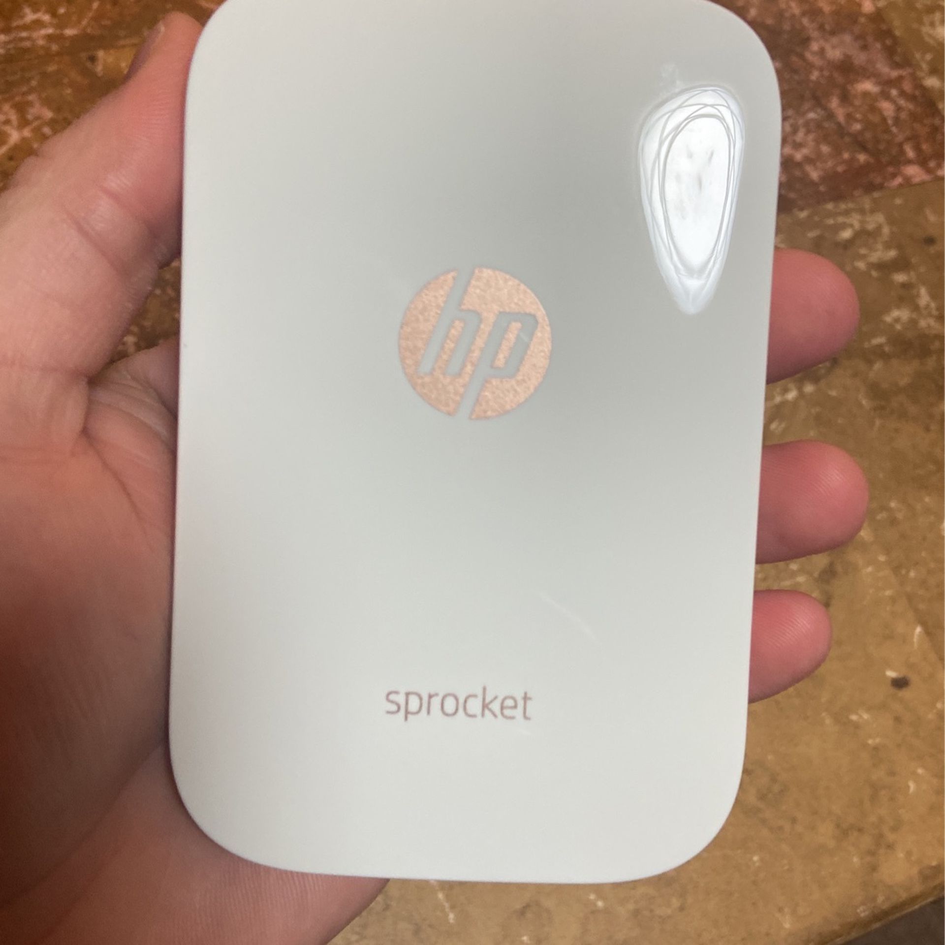 HP Sprocket digital printable photos on the go comes with a box of photos to use and a carrying case