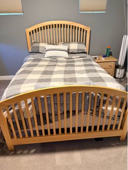 Three piece blonde bedroom set with bed, nightstand and dresser