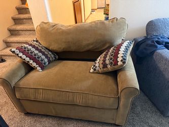 Love seat / couch with bed.
