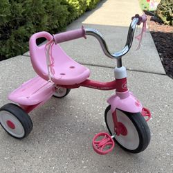 Pink Radio Flyer tricycle