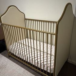 Gold Upholstered Metal Crib With Toddler Bed Rail and Mattress