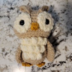 Hand crocheted owl.  I can make in whatever color you prefer. 