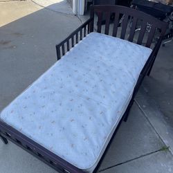 Two toddler beds with mattresses