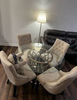 Glass-top dining table with chairs