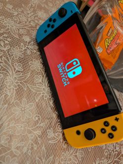 Nintendo Switch with Neon Blue and Yellow Joy-Cons