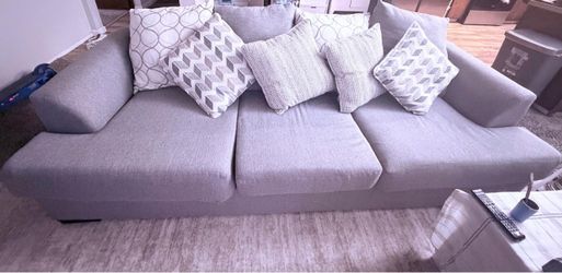 2 Gray Fabric 3-Seat Sofa with Throw Pillows . Buyer is responsible for picking it up and loading it.