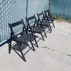 four folding ikea wooden chairs