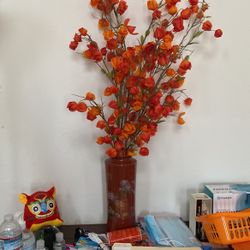 Vase With Beautiful orange flowers