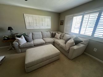 Cream couch with pillows Cream couch with pillows