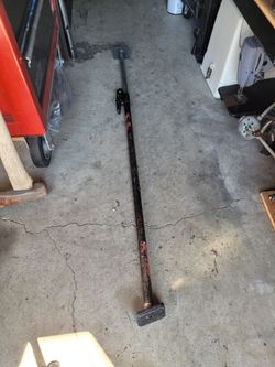Truck retractable cargo bar