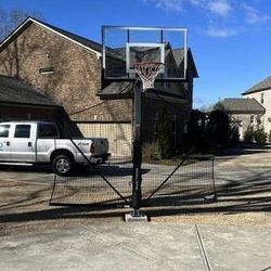 Goaliath 54 inch in ground basketball hoop, adjustable basketball court 