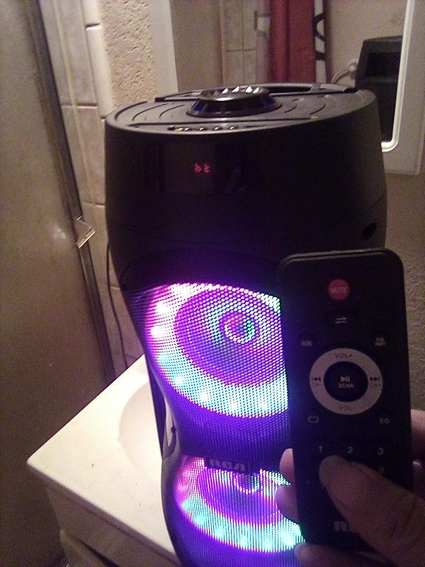 A Nice Boombox With Remote Control And Lights