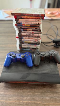 PlayStation three console with games