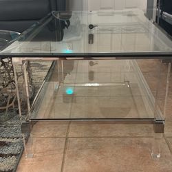 Glass and acrylic coffee table 48” l x 26” w x 18”h