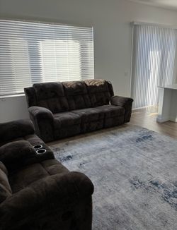 Reclining Couch Set with Floor Rug.