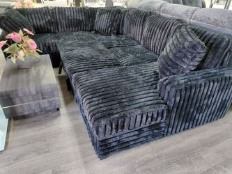 Sectional with pull out bed and storage chaise