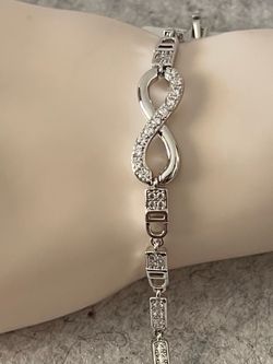 High-quality 14k gold-filled and silver; water-resistant and suitable for daily wear. Silver Infinity Bracelet with Cubic Zirconia.includes an extensi