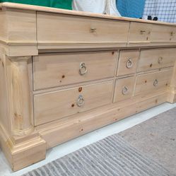 Romweber Solid Pine 9 Drawer Dresser With A Natural Clear Finish And Rustic Metal Ring Pulls.