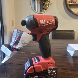 New. Milwaukee M18 FUEL SURGE 18V Lithium-Ion Brushless Cordless 1/4 in. Hex Impact Driver And M18 5.0 BATTERY 