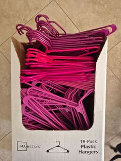 Tons of Pink Plastic Hangers