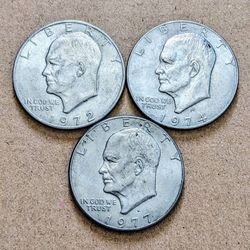 Three (3) assorted 1971~1978 Eisenhower IKE large one dollar coins
