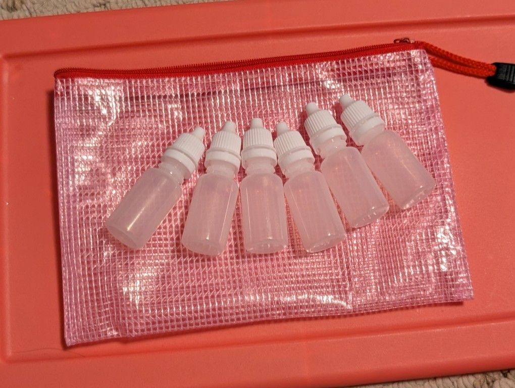 6 mini empty refillable dropper bottles in water proof bag