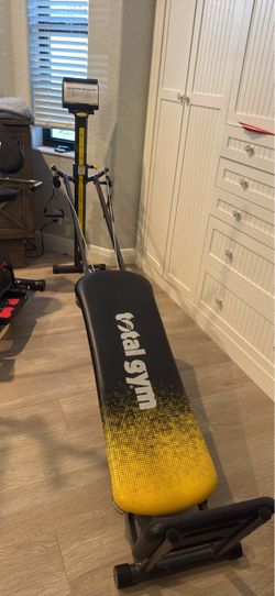 Total Gym with multiple leg accessories