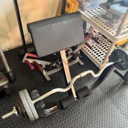 Preachers Bench, Super EZ Curl Bar And 65 Plate Weights Combined For Sale. 