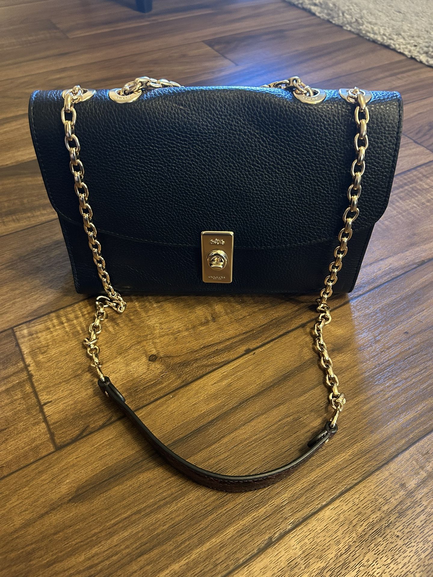 Elegant Coach Black and Gold Lane Shoulder Bag with Chain Strap