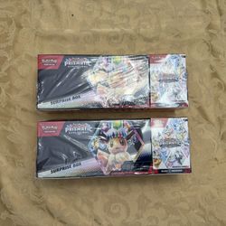 Pokémon Prismatic Evolutions Surprise Box + Booster Bundle