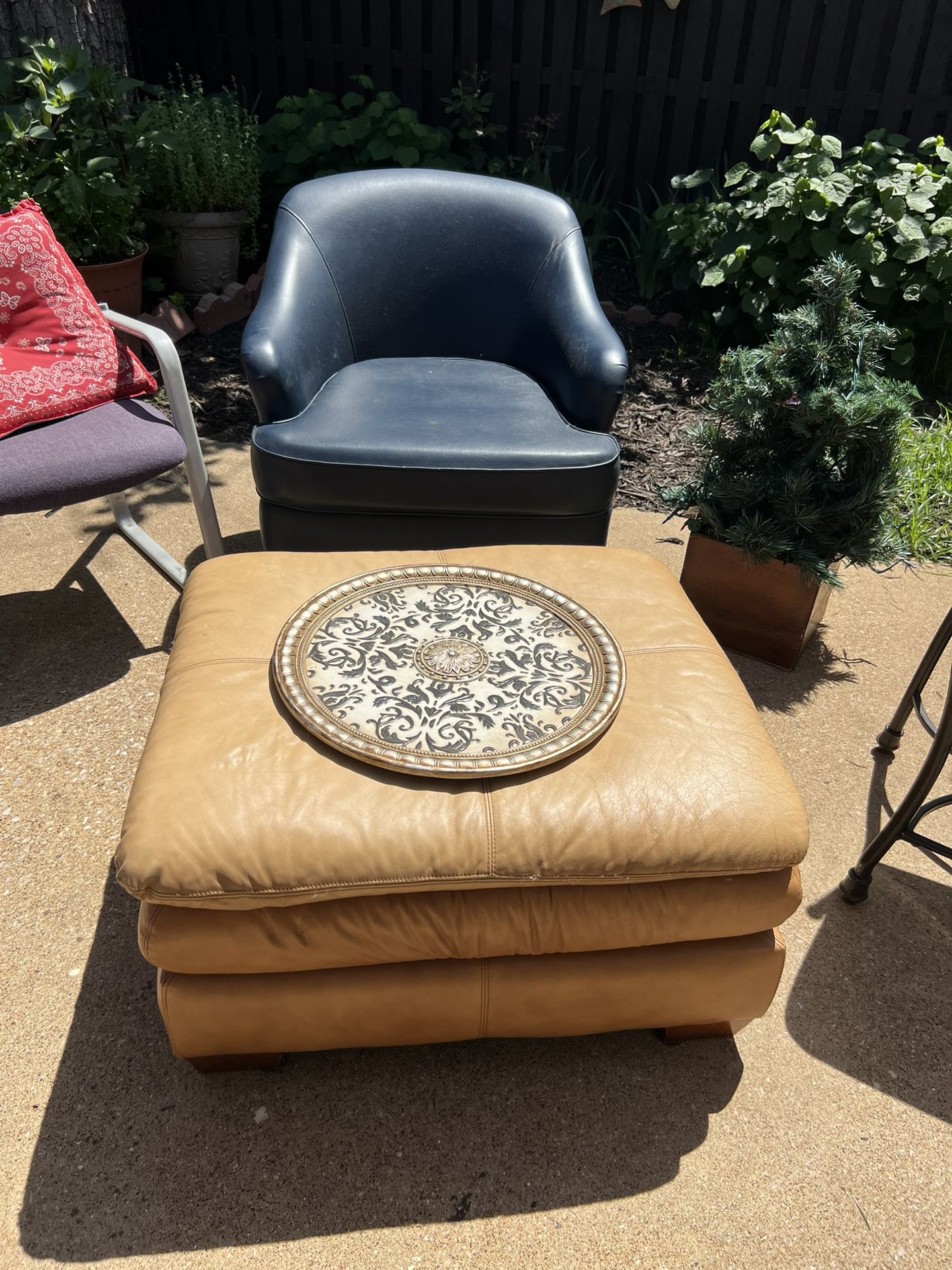 Leather ottoman and a caramel tan color great condition smoke-free home no cut