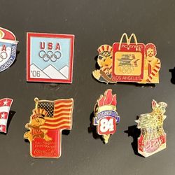 Assortment of Olympic pens, Coca-Cola, and McDonald Pins, ALL 8 of them for the same price.