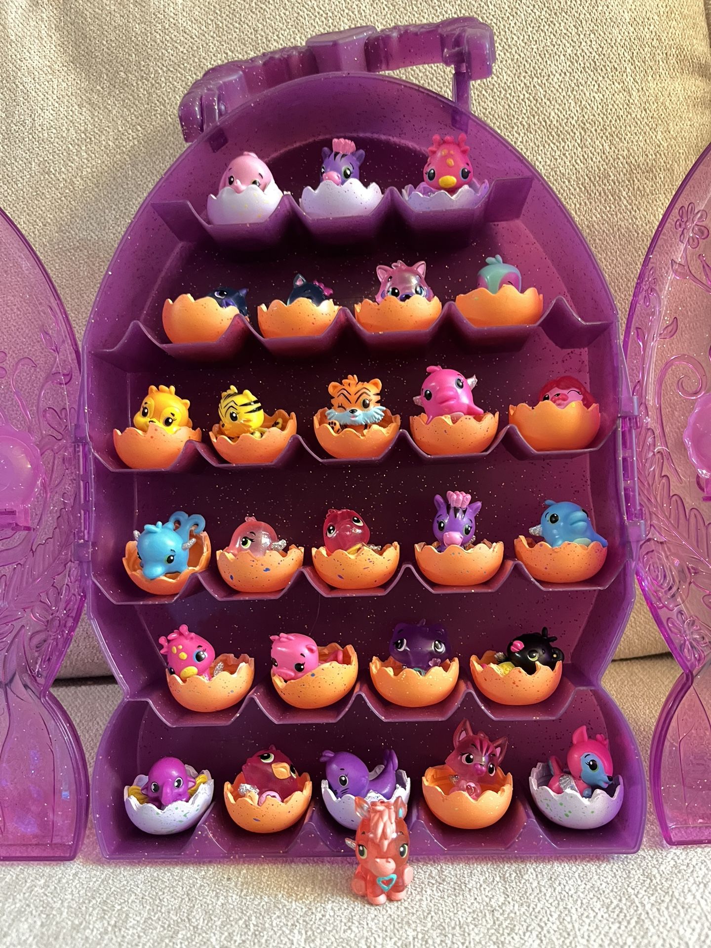 Like New , Hatchimals COLLEGGTIBLES , Lot of 27 Figures with Purple Glitter Case