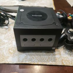 black Nintendo Gamecube, 2 controllers and all the cords