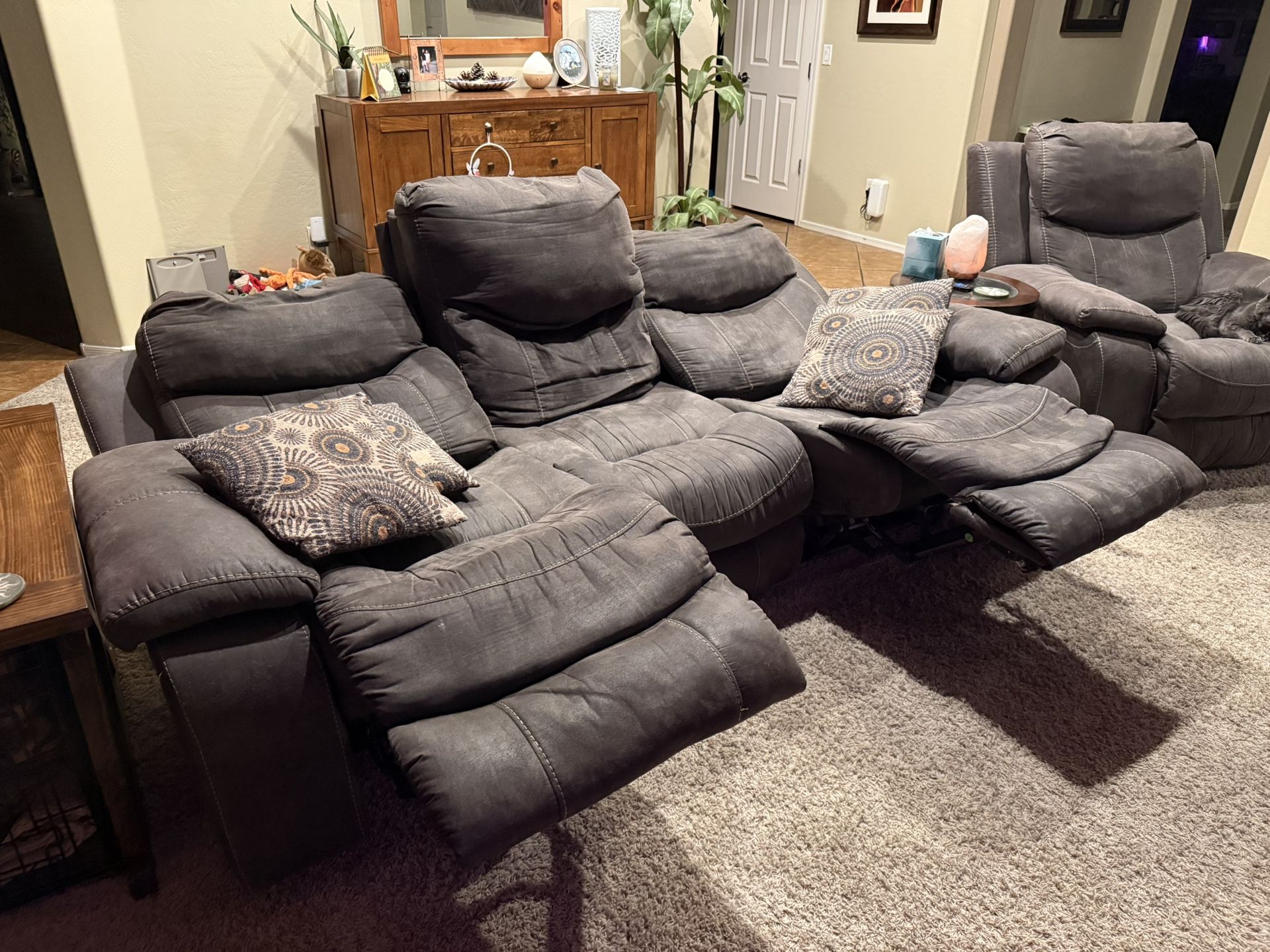 Set: Electric reclining couch and oversized chair set. (Tear on one couch cushion) $500