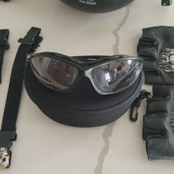 Motorcycle helmet, gloves and riding glasses .