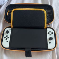 Nintendo Switch OLED and Pokemon dock + 4 games bundle