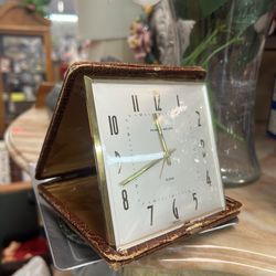 Vintage Phinney-Walker travel alarm clock made in Germany, featuring a manual wind movement and a folding case