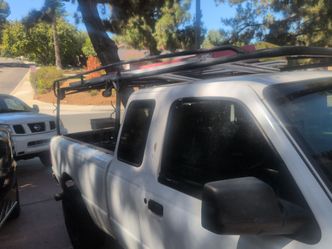 Truck rack with built in straps