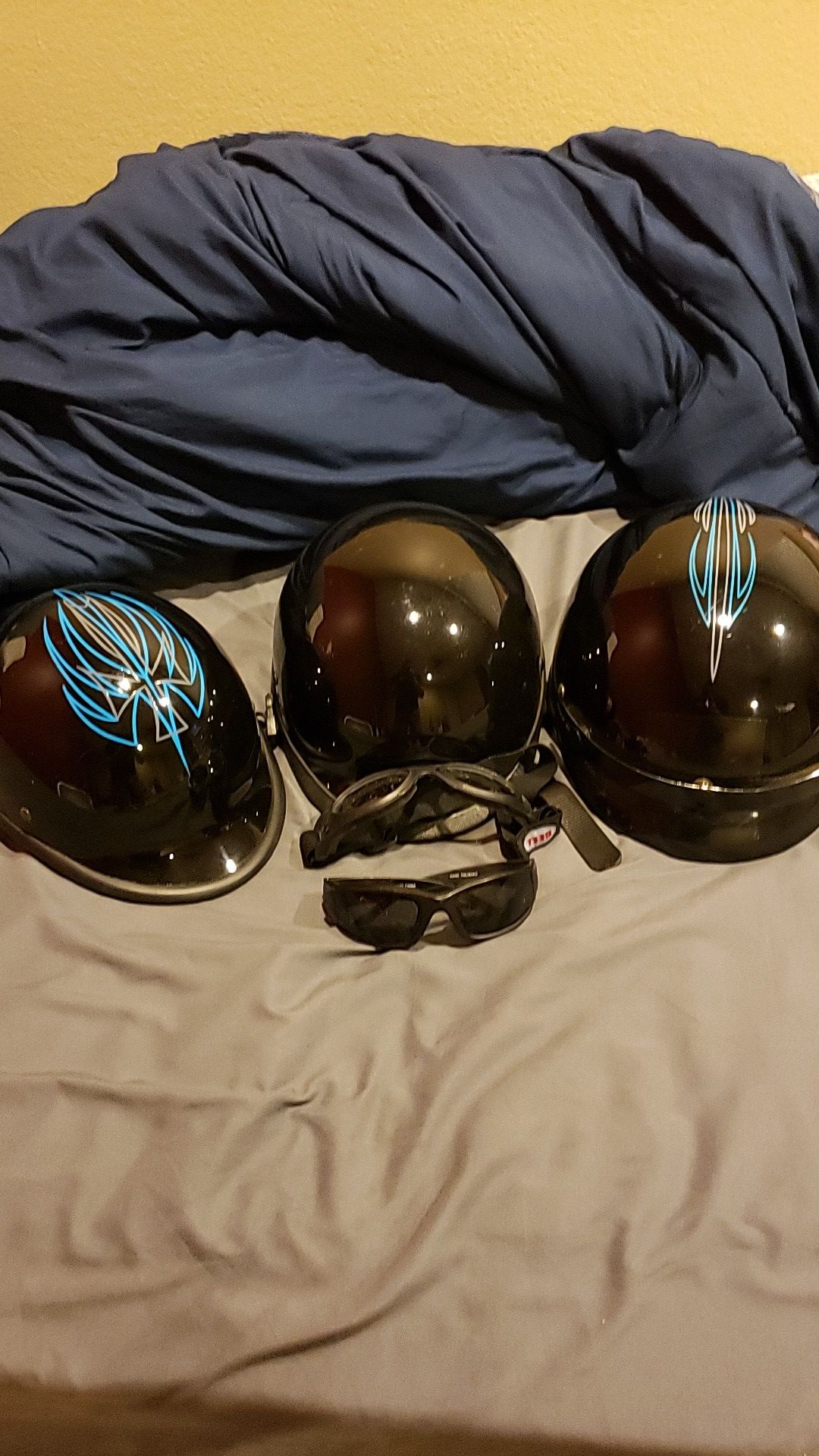 His and hers motorcycle helmets hand pinstriped