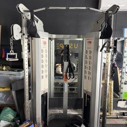  acommercial-grade, corner-friendly dual adjustable pulley system and functional trainer designed for full-body strength and rehabilitation exercises