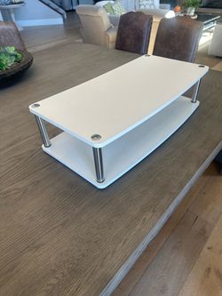 Two tier swivel riser
