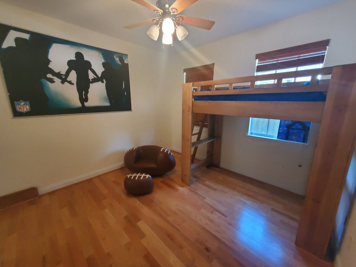 Rooms to Go Kids bunk bed with matress plus football wall mural, plus football chair, plus football foot rest. $100