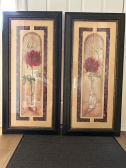Set of two framed floral artworks with black frames and under glass. 22 x 46. Ready to hang.
